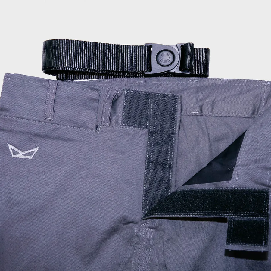 Charcoal FNTQ gi pants with the pocket flap closed flat under the belt